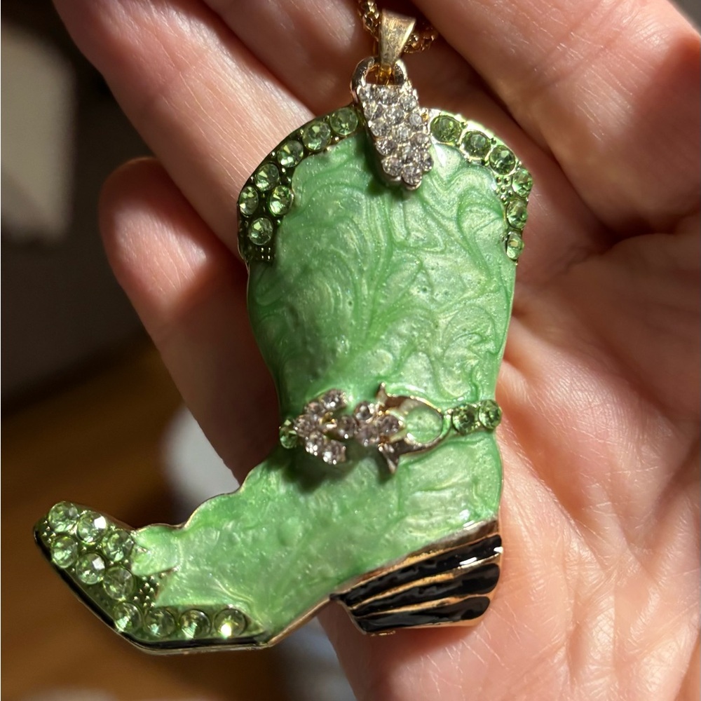 Green Rhinestone Cowboy Boot Pendant Necklace in Gold-Tone base metal. 24” Chain